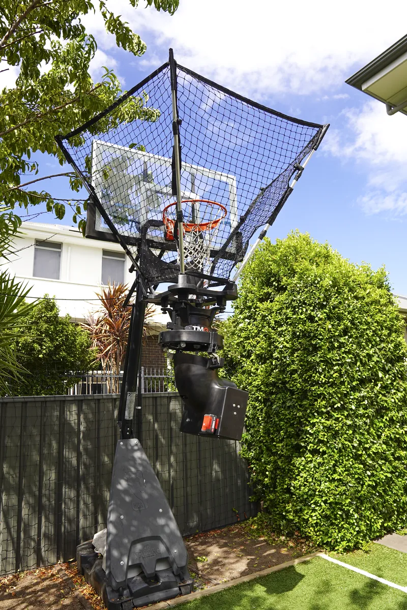 Player shooting at the TMG Assist catch net up close